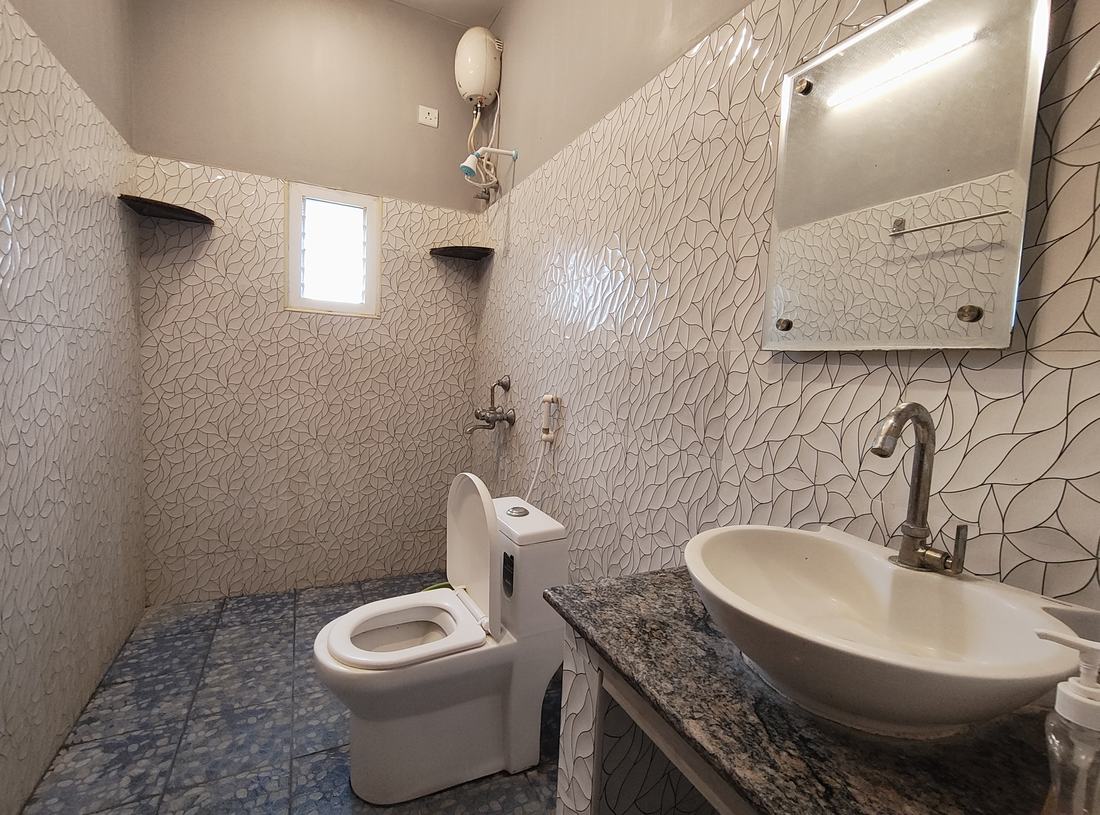 Arcadia room F8, Art Le Cafe Auroville — bathroom with sink and toilet