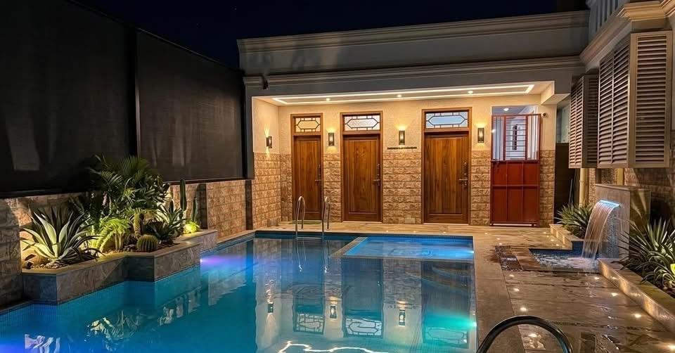 Osiris room S18, Art Le Cafe Auroville — pool area at night